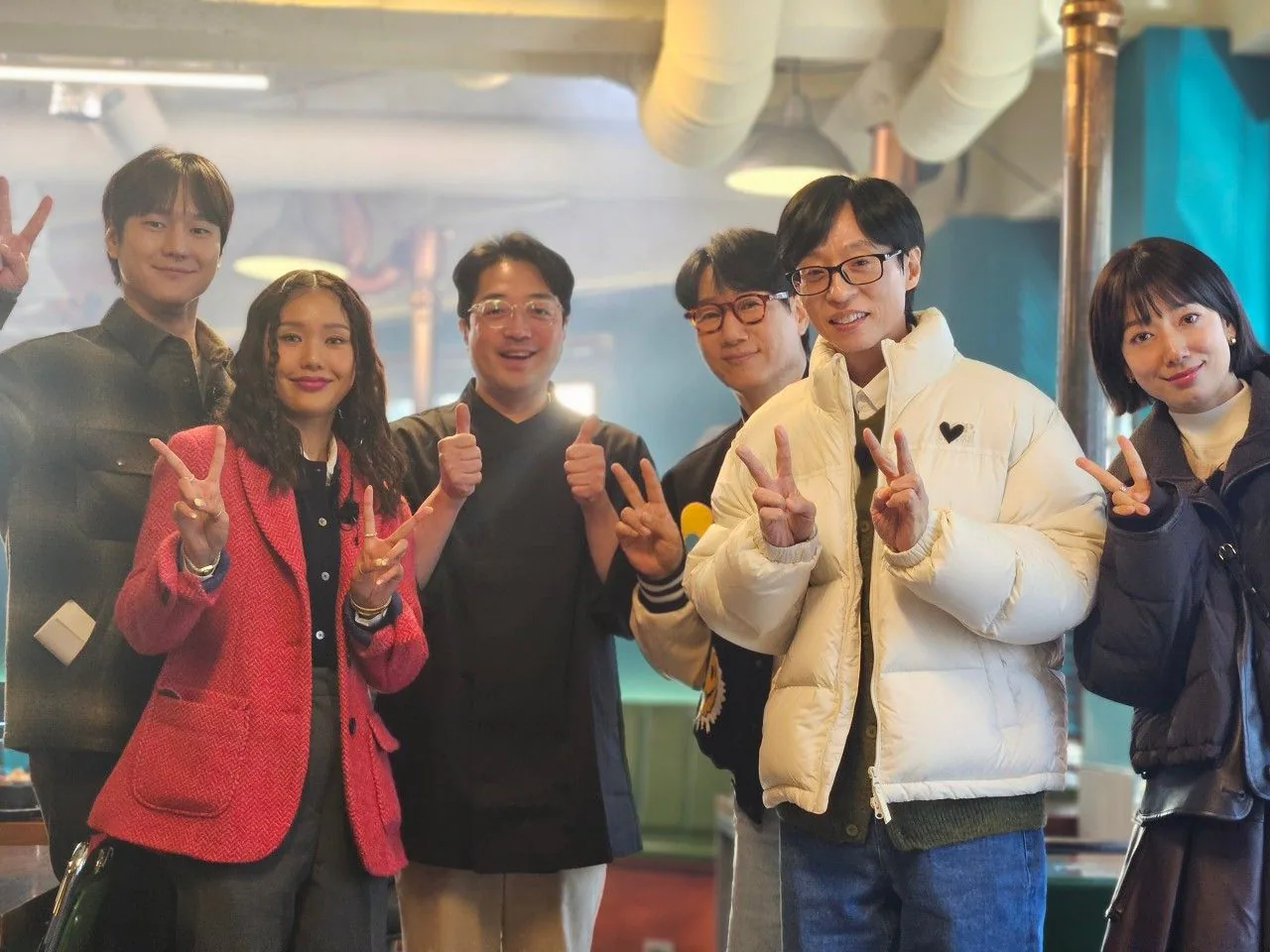 Six people posing together inside Heukwoojeong